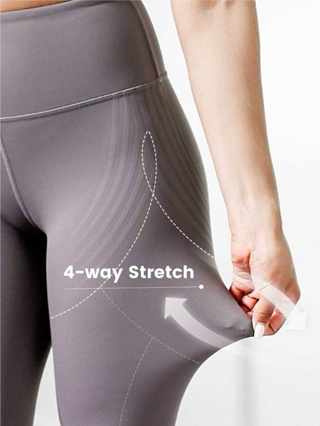 A close-up, minimalist product shot that uses a clean diagrammatic overlay to highlight the elasticity and comfort of the leggings.